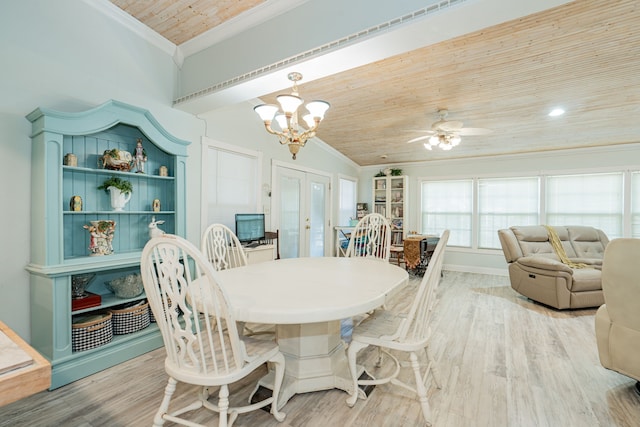 dining space with wood ceiling, french doors, crown molding, and light wood finished floors