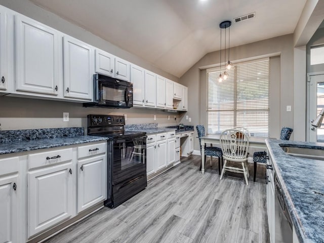 kitchen with black appliances, a sink, visible vents, and white cabinetry