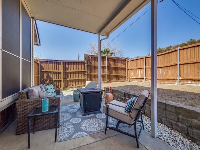 view of patio / terrace featuring an outdoor hangout area and a fenced backyard