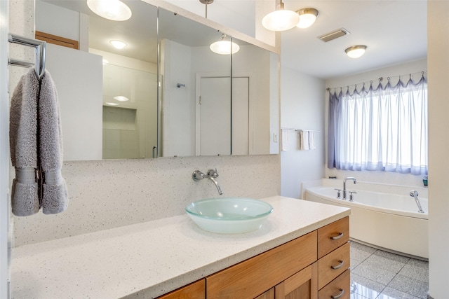 bathroom featuring a garden tub, tile patterned flooring, vanity, visible vents, and a shower stall