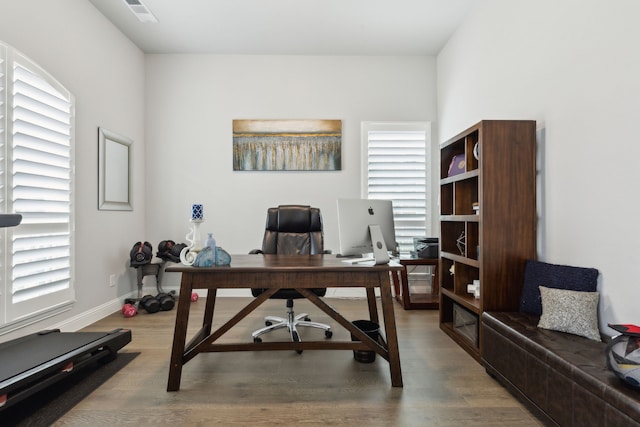 1600 Pebblebrook Ln, Prosper, TX 75078 - office featuring visible vents, baseboards, wood finished floors, and a healthy amount of sunlight