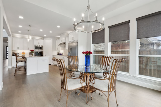 1600 Pebblebrook Ln, Prosper, TX 75078 - dining area featuring baseboards, recessed lighting, a chandelier, and wood finished floors