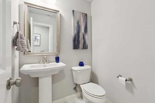 1600 Pebblebrook Ln, Prosper, TX 75078 - bathroom featuring toilet, a sink, baseboards, and visible vents