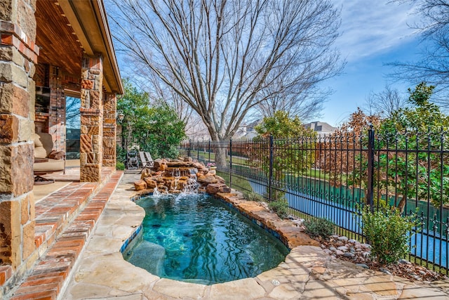 view of pool featuring a patio, fence, and a fenced in pool