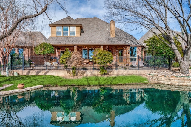 back of house with a shingled roof, fence, a patio area, a swimming pool, and a chimney