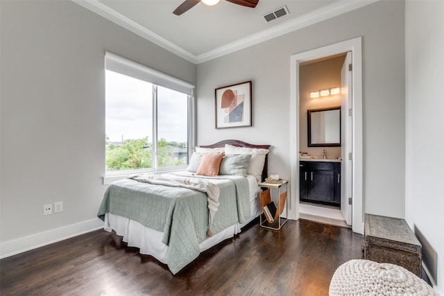 bedroom featuring baseboards, visible vents, dark wood-type flooring, and crown molding