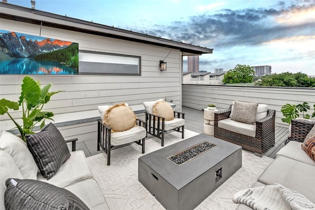 view of patio / terrace featuring an outdoor living space with a fire pit