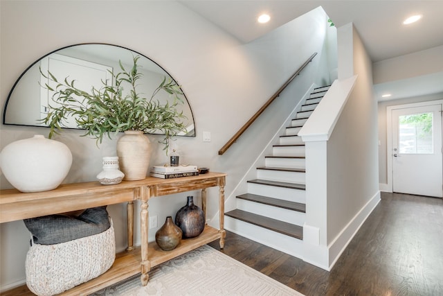 stairway with recessed lighting, baseboards, and wood finished floors