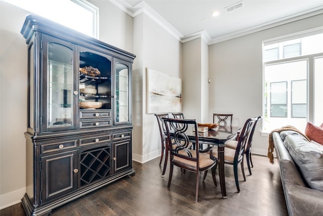 dining room with recessed lighting, visible vents, baseboards, dark wood finished floors, and crown molding