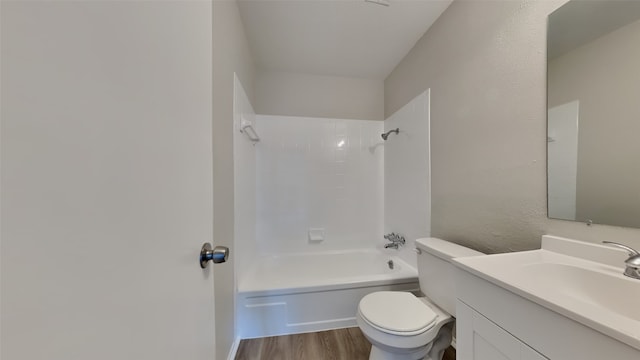 full bath featuring shower / bathtub combination, vanity, toilet, and wood finished floors