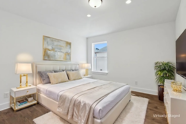 bedroom featuring dark wood-style flooring, recessed lighting, and baseboards