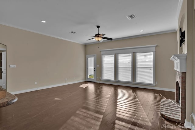 unfurnished living room with crown molding, visible vents, and a fireplace