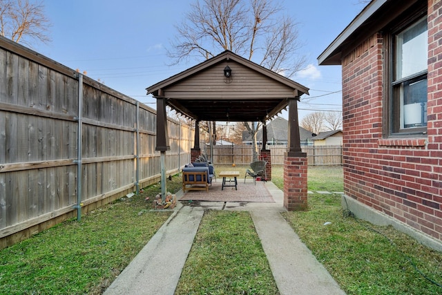 view of yard with a fenced backyard and a patio