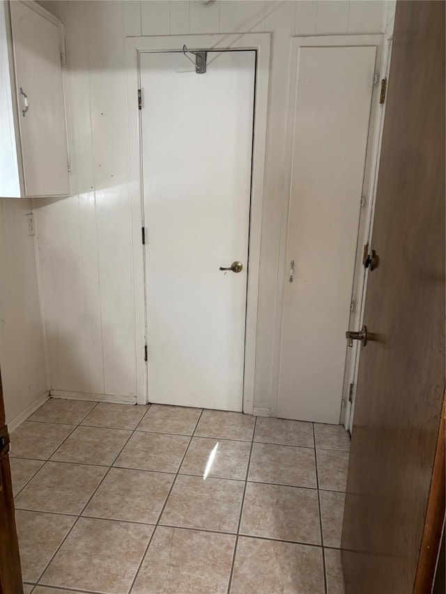 corridor featuring light tile patterned flooring