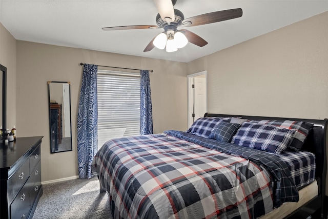 carpeted bedroom featuring a ceiling fan and baseboards