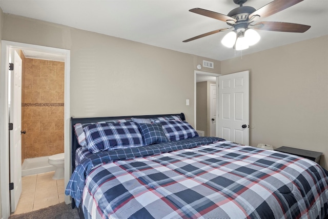 bedroom with ensuite bathroom, ceiling fan, tile patterned flooring, and visible vents