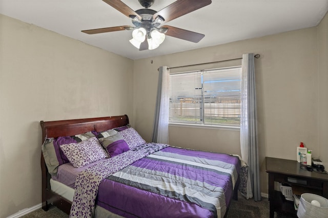 bedroom with carpet, a ceiling fan, and baseboards