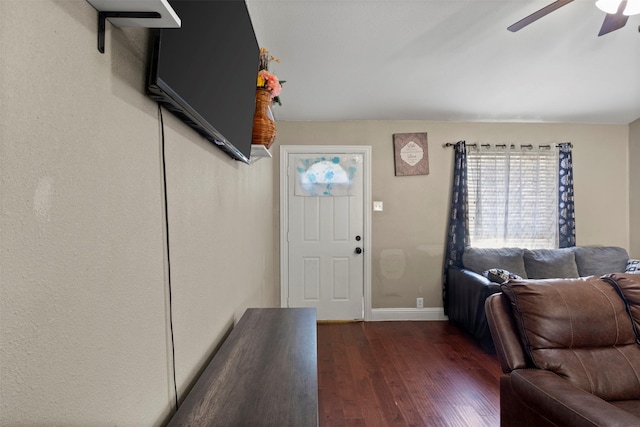 entryway with ceiling fan, baseboards, and wood finished floors