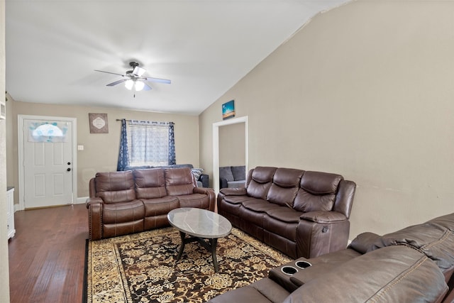 living room with ceiling fan, vaulted ceiling, baseboards, and wood finished floors