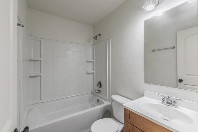 bathroom with toilet, a textured wall, shower / bathing tub combination, and vanity