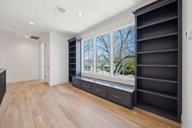 interior space featuring light wood-style flooring, visible vents, baseboards, and recessed lighting