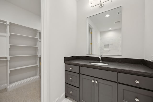 full bathroom with baseboards, visible vents, a shower, vanity, and recessed lighting