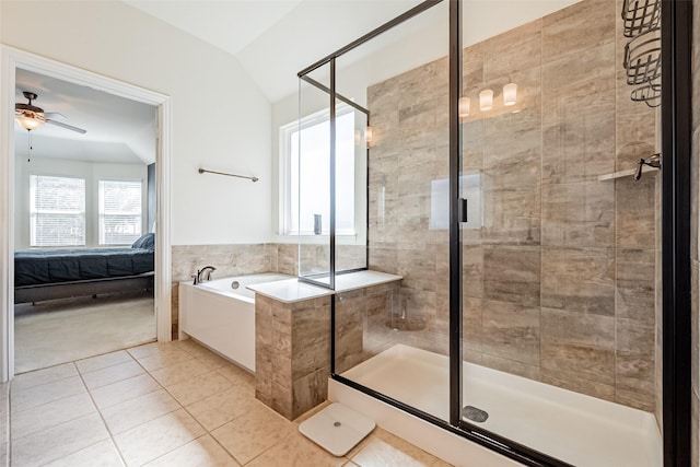 full bath with a stall shower, a ceiling fan, connected bathroom, tile patterned floors, and a garden tub