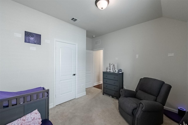 bedroom featuring vaulted ceiling, light carpet, visible vents, and baseboards