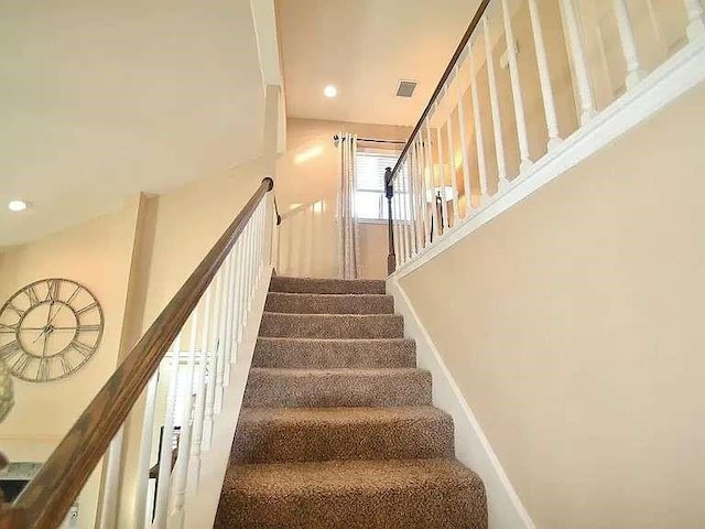 stairs featuring visible vents and recessed lighting