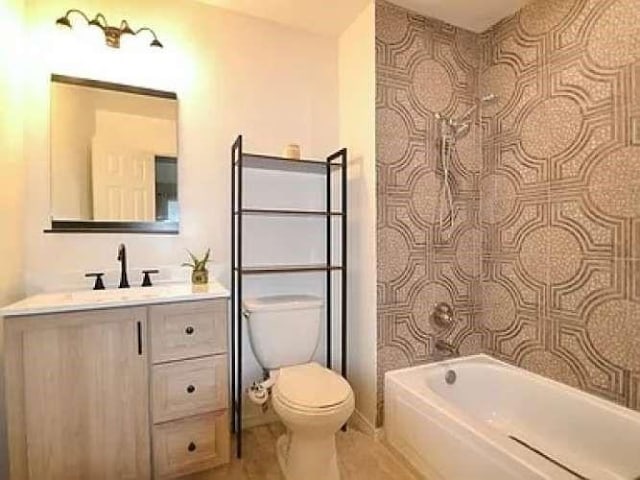 bathroom featuring toilet, tile patterned floors, and vanity