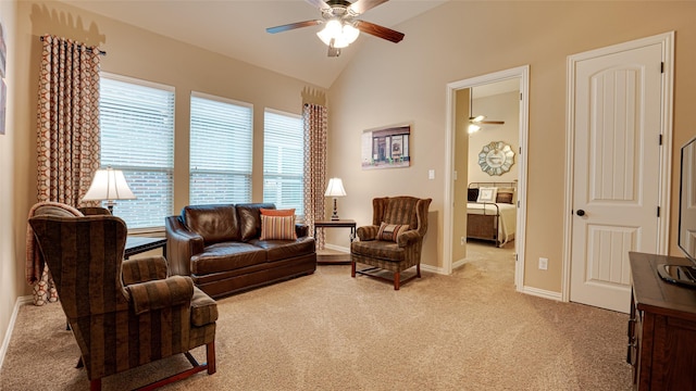 living room featuring lofted ceiling, ceiling fan, baseboards, and light colored carpet