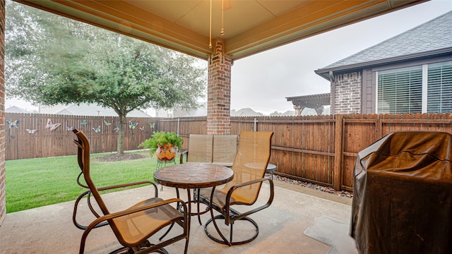 view of patio / terrace featuring a fenced backyard, outdoor dining area, and area for grilling