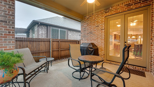 view of patio / terrace featuring fence and ceiling fan