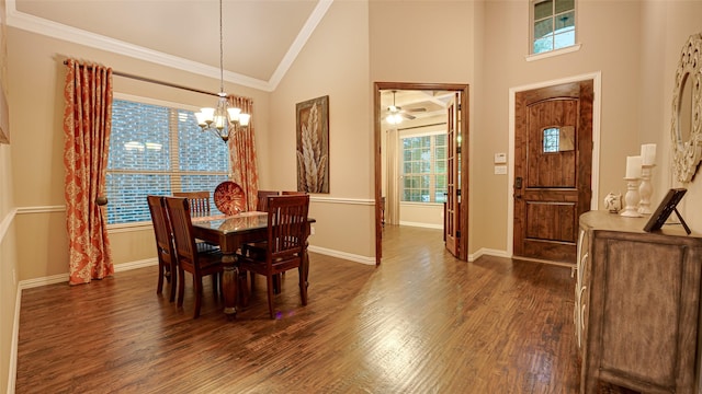 dining space with high vaulted ceiling, a notable chandelier, baseboards, ornamental molding, and dark wood finished floors