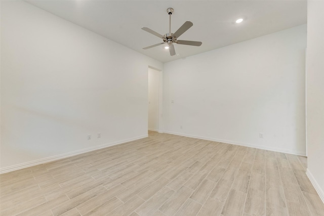 empty room with recessed lighting, baseboards, ceiling fan, and light wood finished floors