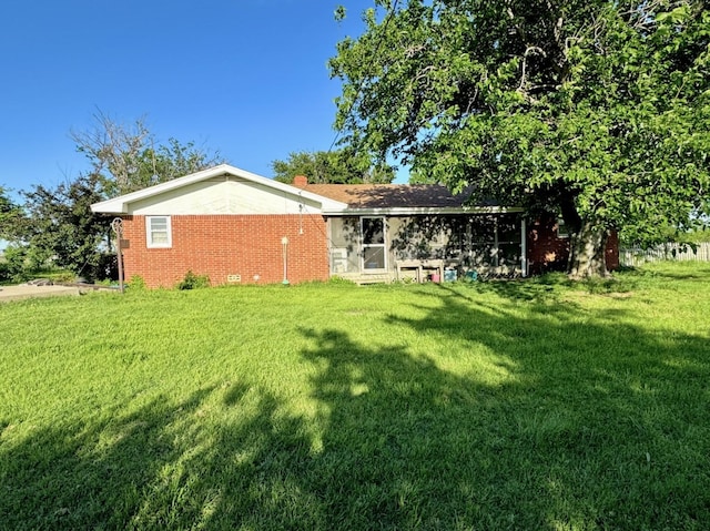 188 Walker Rd, Olney, TX 76374 - rear view of house with a lawn