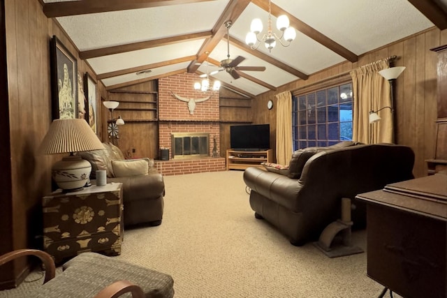 188 Walker Rd, Olney, TX 76374 - living area with wooden walls, a ceiling fan, carpet flooring, a fireplace, and a chandelier