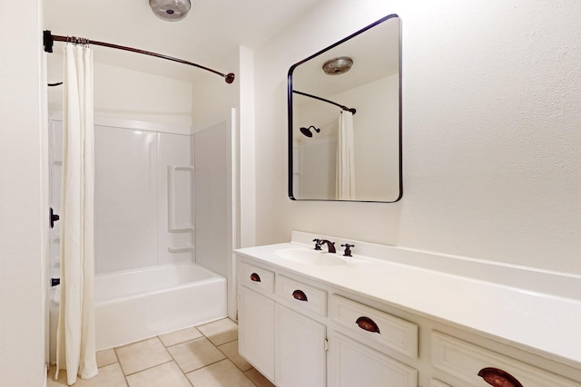 full bath with vanity, tile patterned floors, and shower / tub combo with curtain