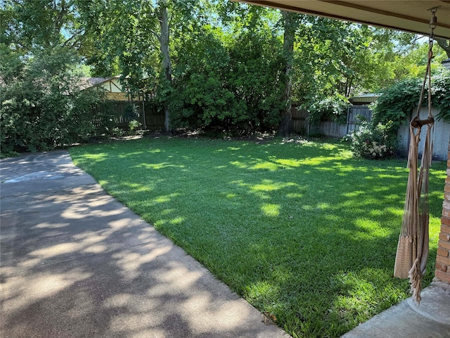view of yard with a fenced backyard