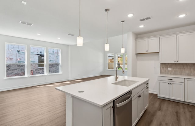 14574 Elion Ct, Pilot Point, TX 75009 - kitchen featuring a sink, visible vents, dishwasher, light countertops, and dark wood-type flooring
