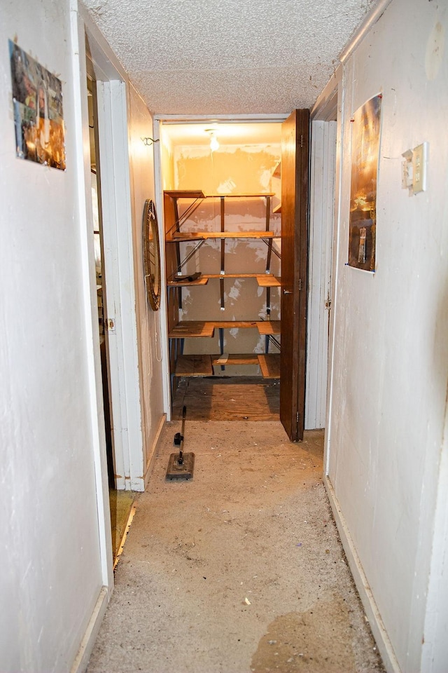 hallway featuring a textured ceiling