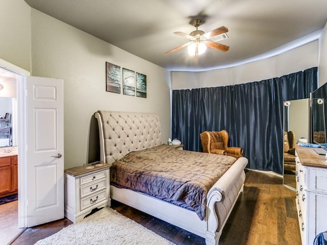 bedroom with dark wood finished floors and a ceiling fan