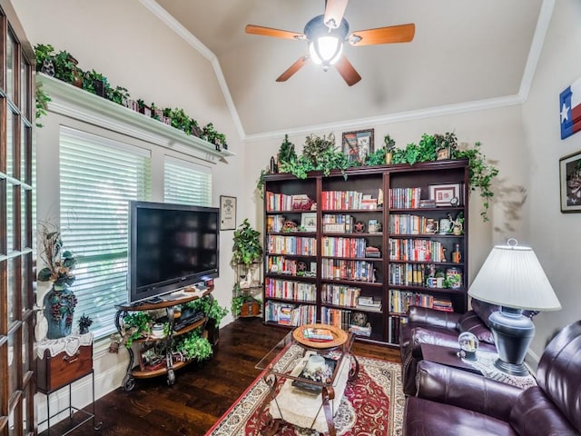 living room featuring a ceiling fan, ornamental molding, vaulted ceiling, and wood finished floors