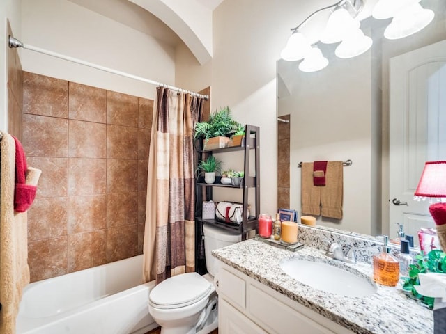 bathroom featuring vanity, toilet, and shower / bathtub combination with curtain