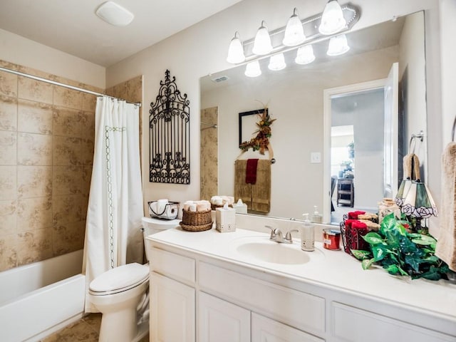 bathroom featuring toilet, shower / tub combo, visible vents, vanity, and tile patterned floors