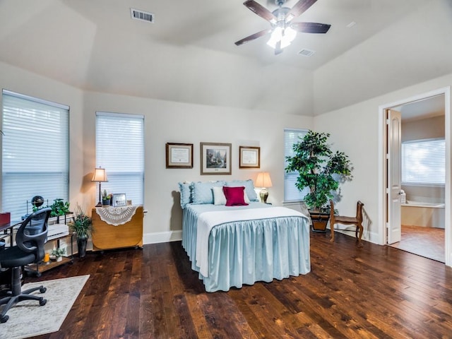 bedroom featuring hardwood / wood-style flooring, baseboards, and vaulted ceiling