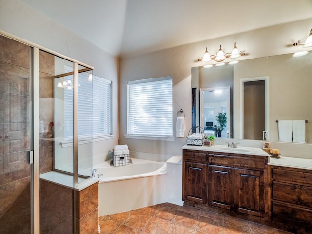 full bathroom with a garden tub, lofted ceiling, a shower stall, vanity, and tile patterned floors