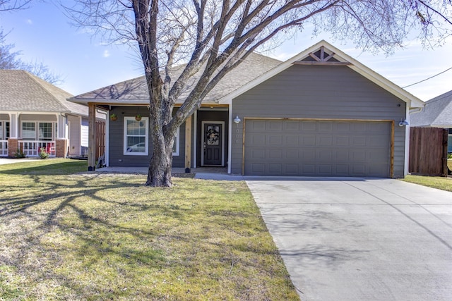 view of front facade with an attached garage, driveway, a front lawn, and a shingled roof