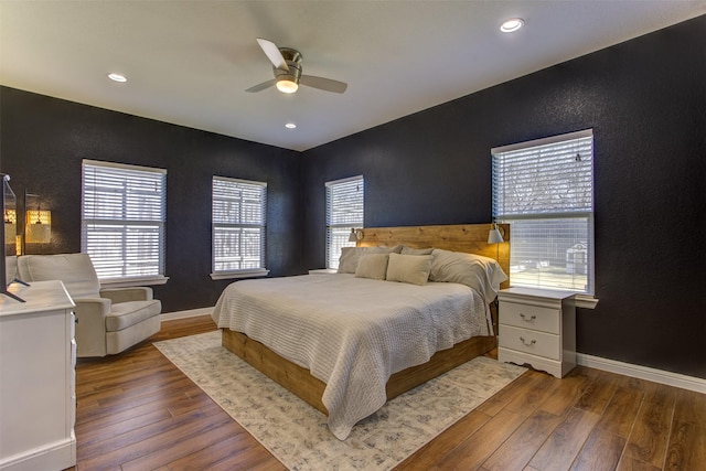 bedroom with dark wood-style floors, ceiling fan, baseboards, and recessed lighting