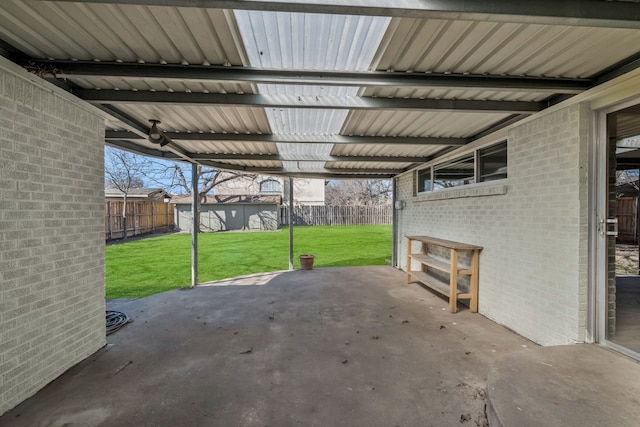 view of patio / terrace with a fenced backyard and an outdoor structure